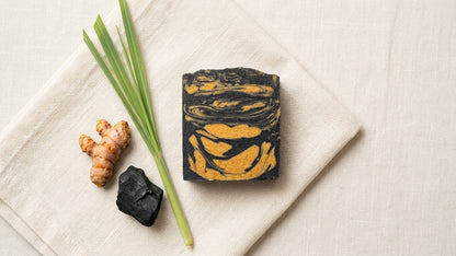 The Golden Obsidian - Turmeric, Activated Charcoal - Tea Tree, Lemongrass, and Cedarwood Essential Oil.
